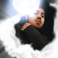 a photo of a man with a moon in the background